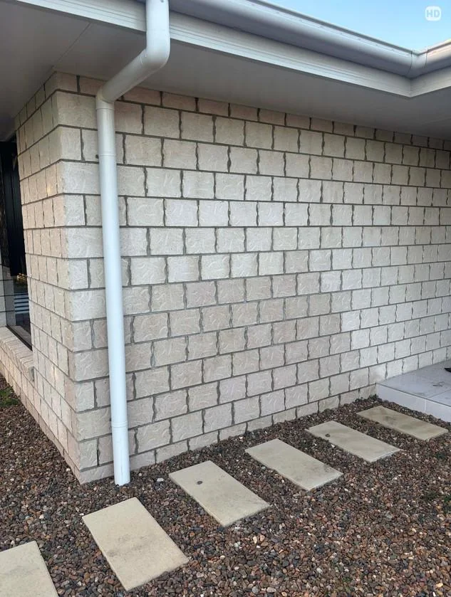 Exterior wall of a Portland home checked for basement waterproofing before choosing a method
