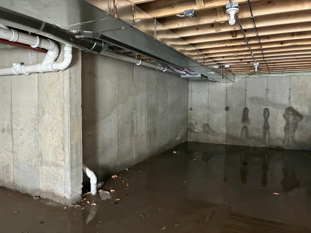 Basement waterproofing Portland OR crew assessing water damage before crawl space repair