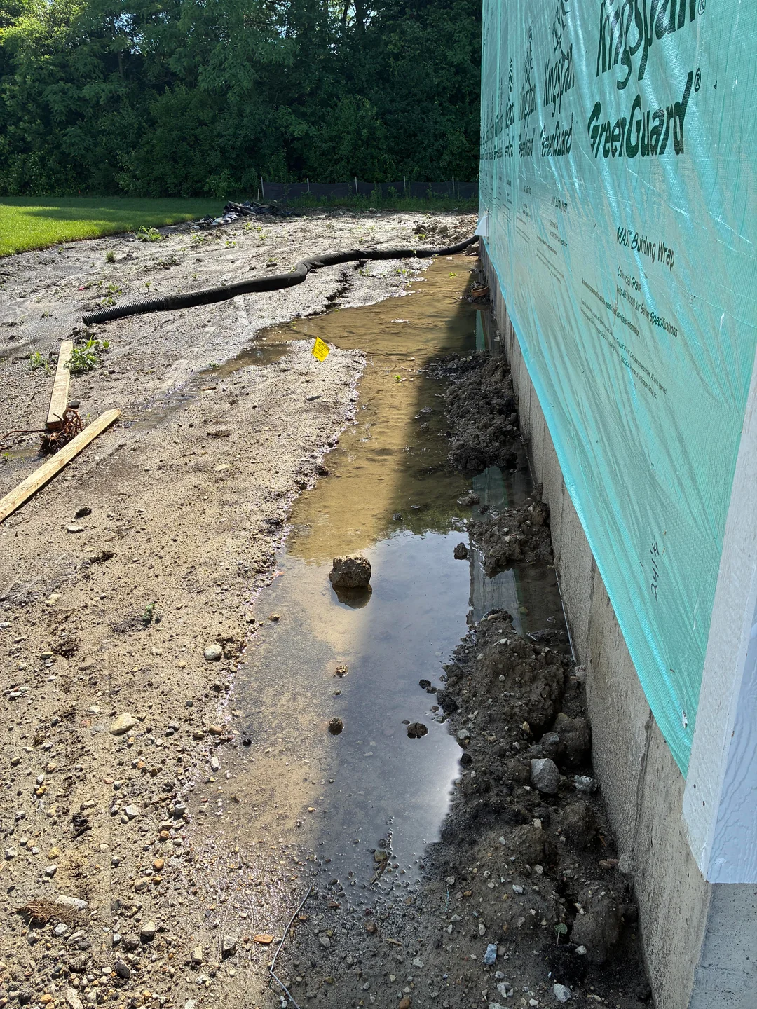 Basement waterproofing Portland OR, a foundation wall wrapped in waterproofing membrane
