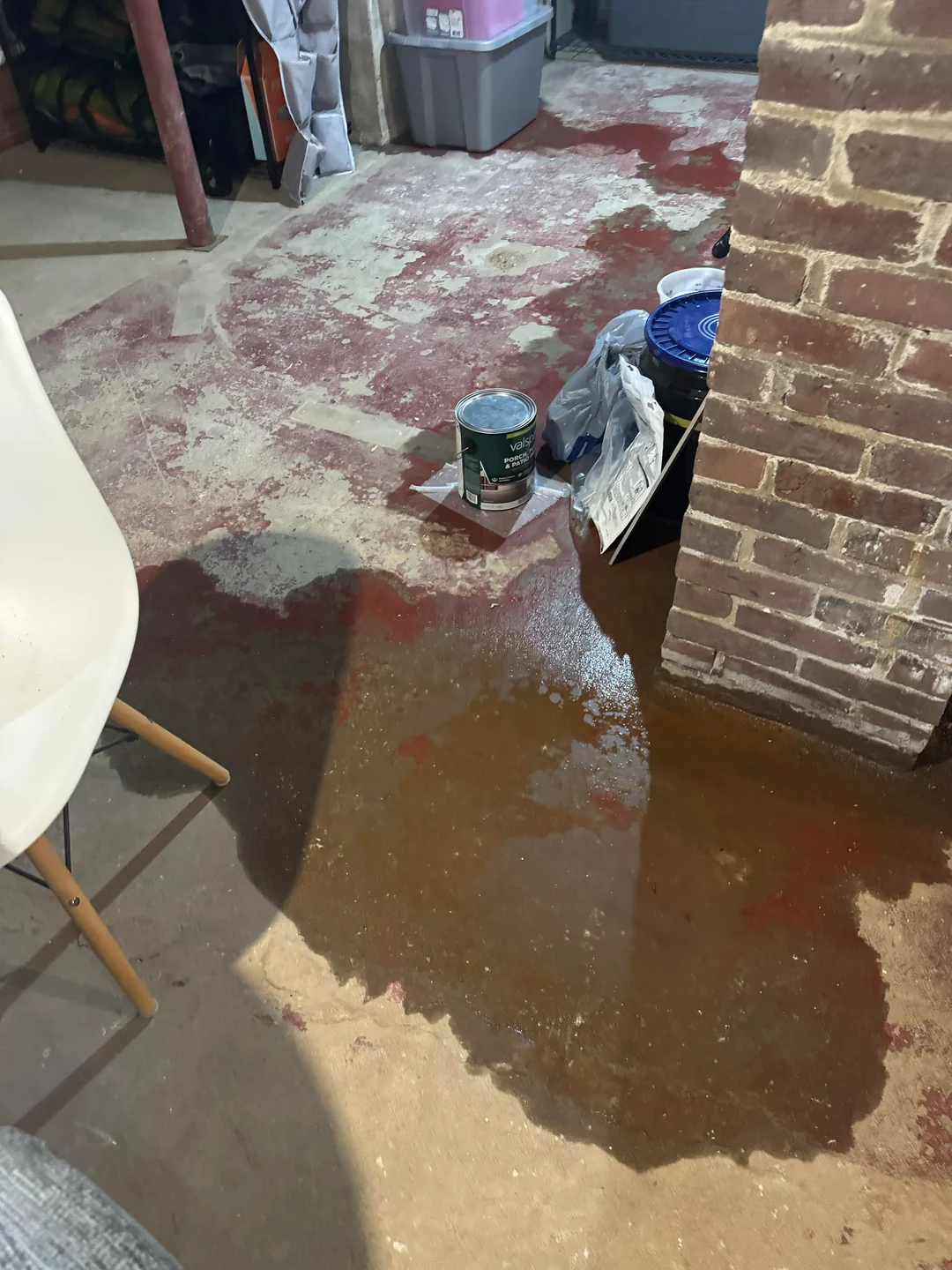 Standing water pooling on a Portland basement floor, an early sign basement waterproofing is needed