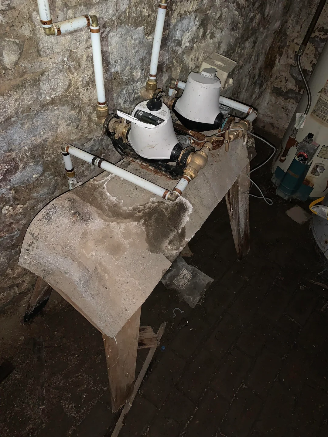 Basement waterproofing Portland crew exposing a foundation wall corner for push pier support in Kenton